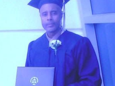 A person holding a diploma